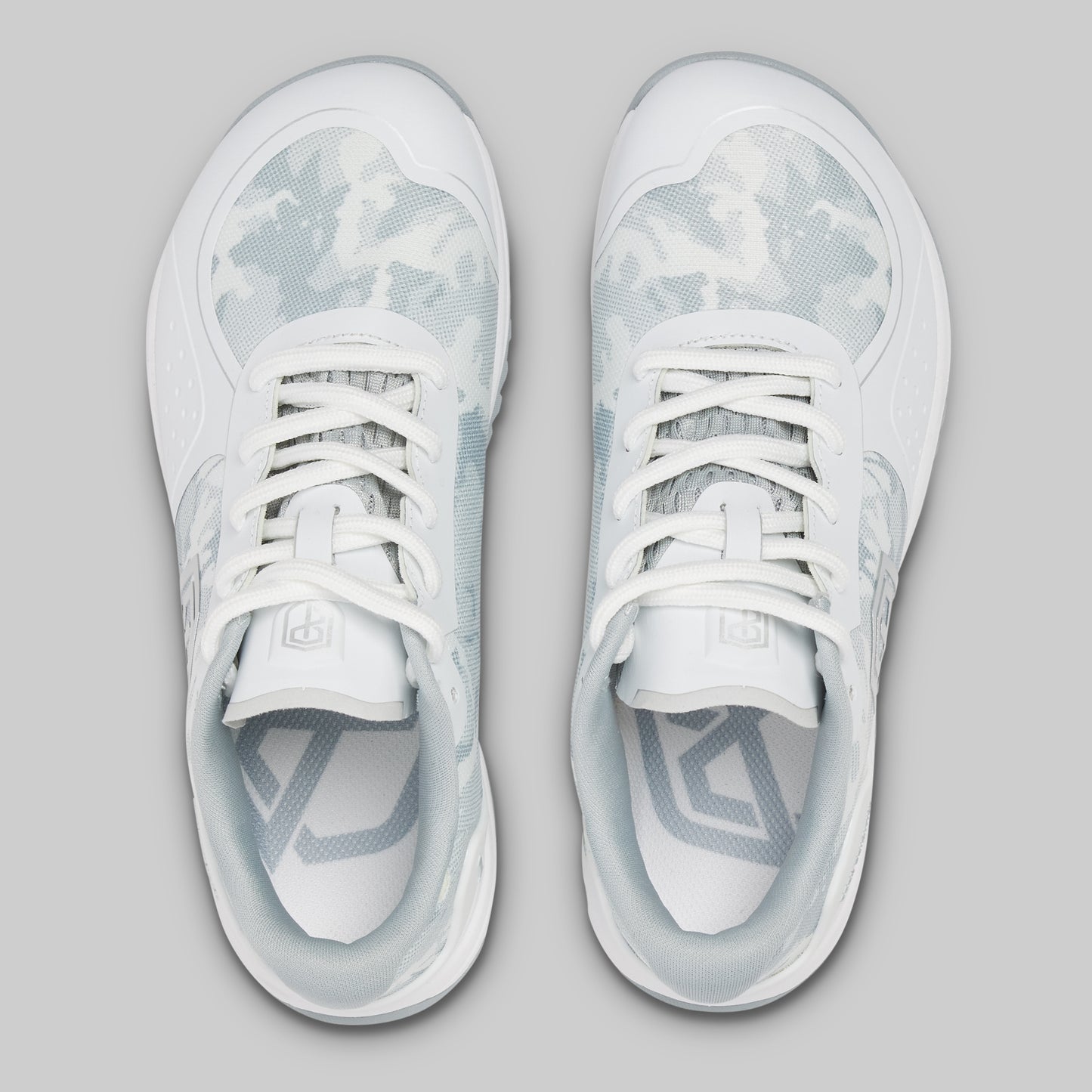 White sneakers with gray accents on a light gray background