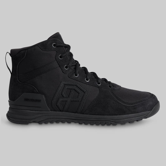 Black tactical boot on a light gray background