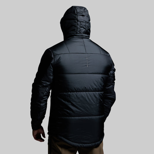 Black puffer jacket with a hood on a gray background