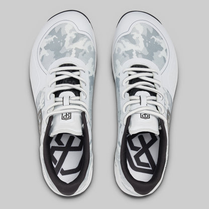 White athletic shoes with black accents on a gray background