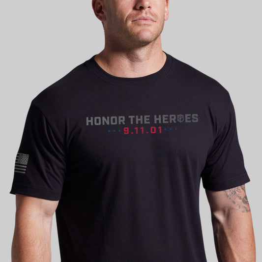 Man wearing a black 9/11 25th Anniversary tee, front with Honor the Heroes and 9.11.01 graphic