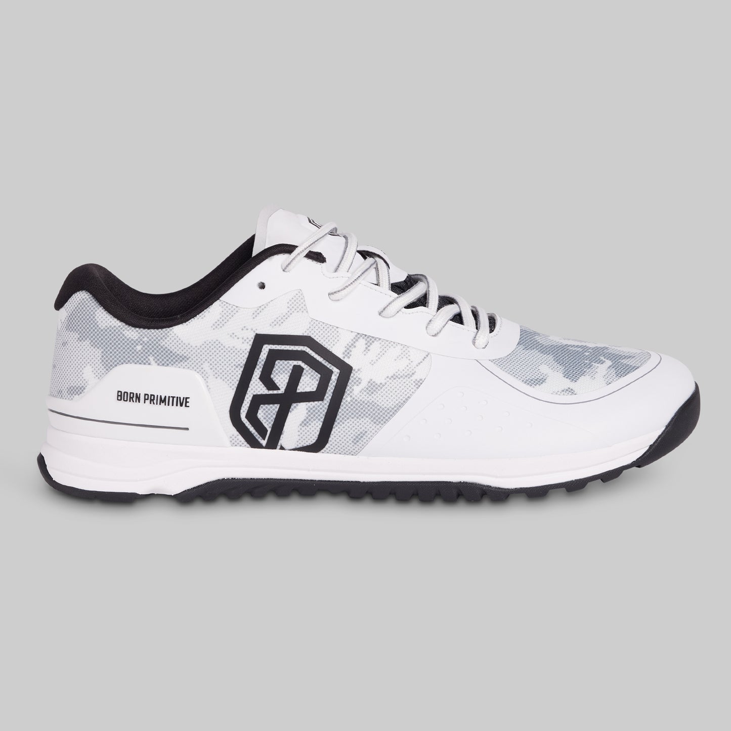 White athletic shoe with black accents on a gray background