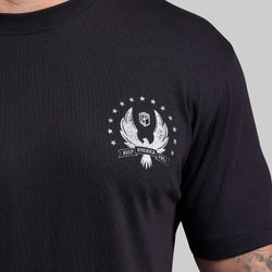 Black t-shirt with a white graphic design on a gray background