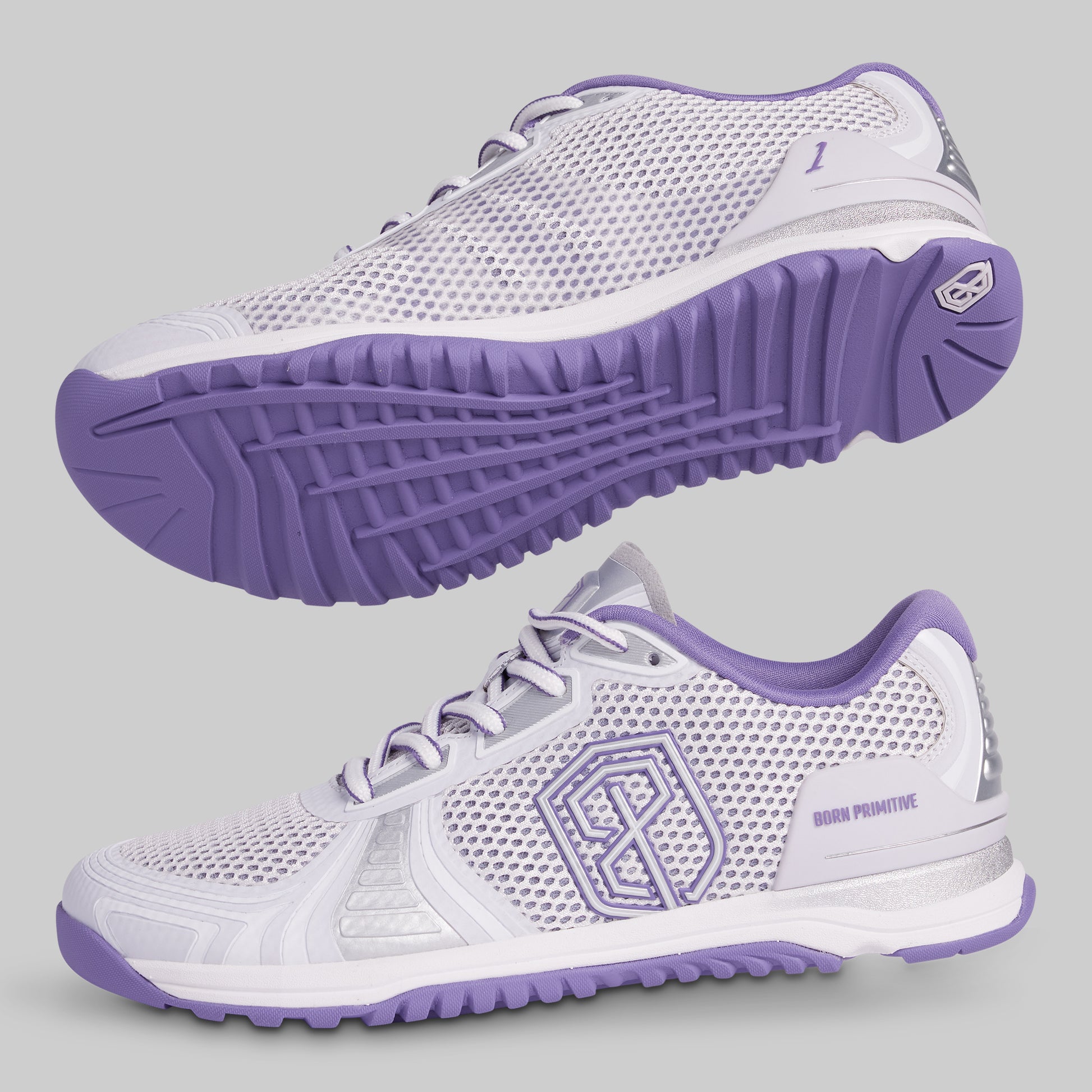 White and purple athletic shoes with a brand logo on a gray background