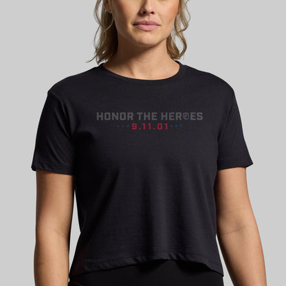Woman wearing a black 9/11 25th Anniversary crop tee, front with Honor the Heroes and 9.11.01 graphic