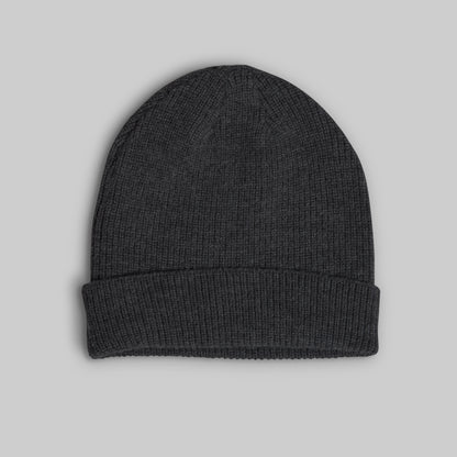 A dark charcoal gray ribbed knit beanie hat with a folded cuff, shown flat against a solid light gray background.