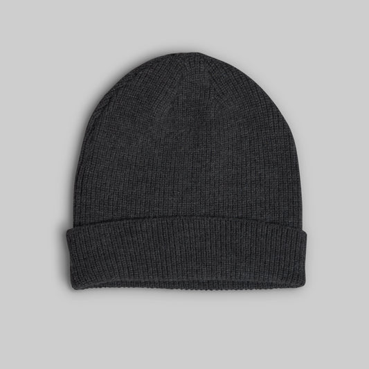 A dark charcoal gray ribbed knit beanie hat with a folded cuff, shown flat against a solid light gray background.