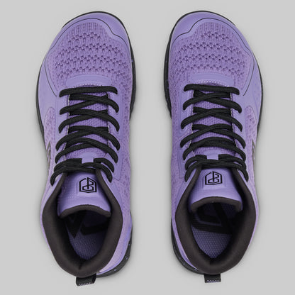 Purple athletic shoes with black laces on a light gray background