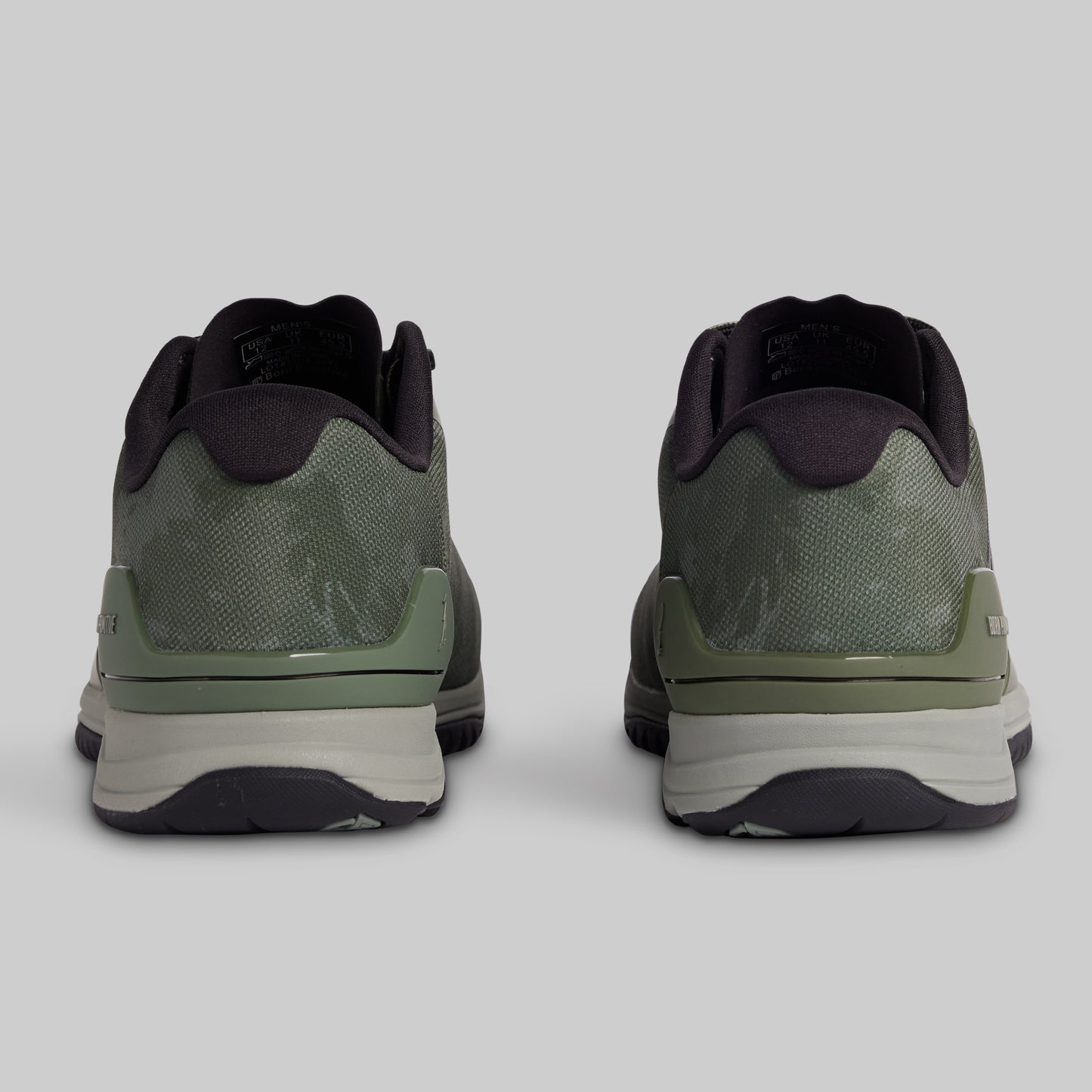 Pair of green athletic shoes on a light gray background