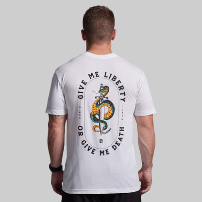 Person wearing a white t-shirt with a snake graphic and text on the back against a gray background