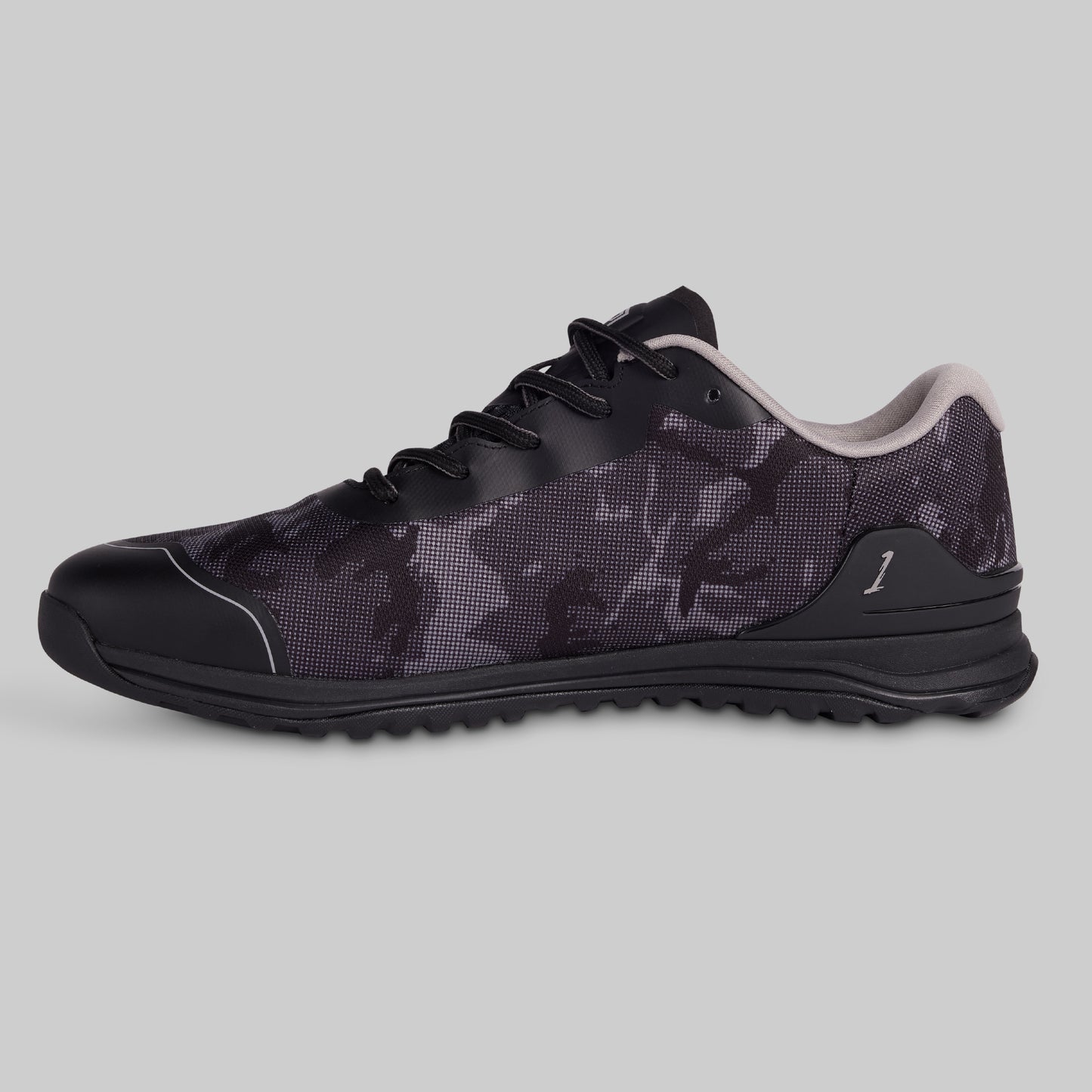Black and gray sneaker on a light gray background