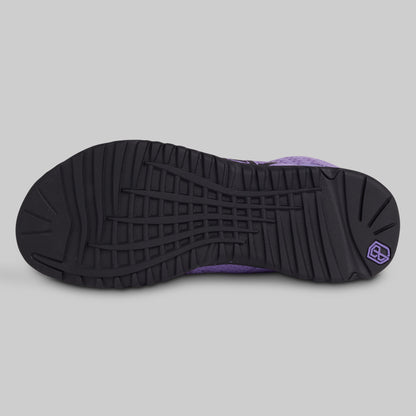 Black and purple sneaker sole on a gray background
