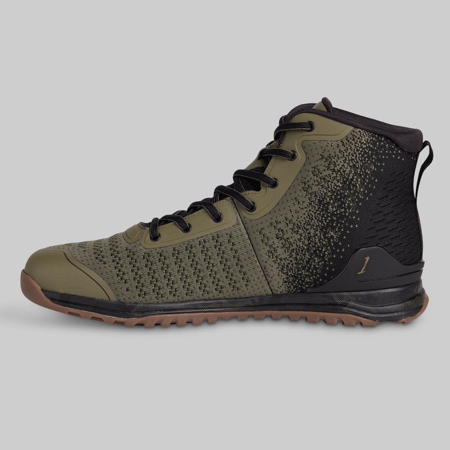Green high-top sneaker with black speckles on a gray background