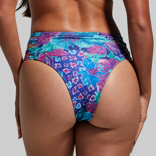 Colorful floral-patterned bikini bottom on a neutral background