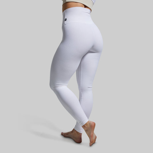 White leggings worn by a person on a light gray background