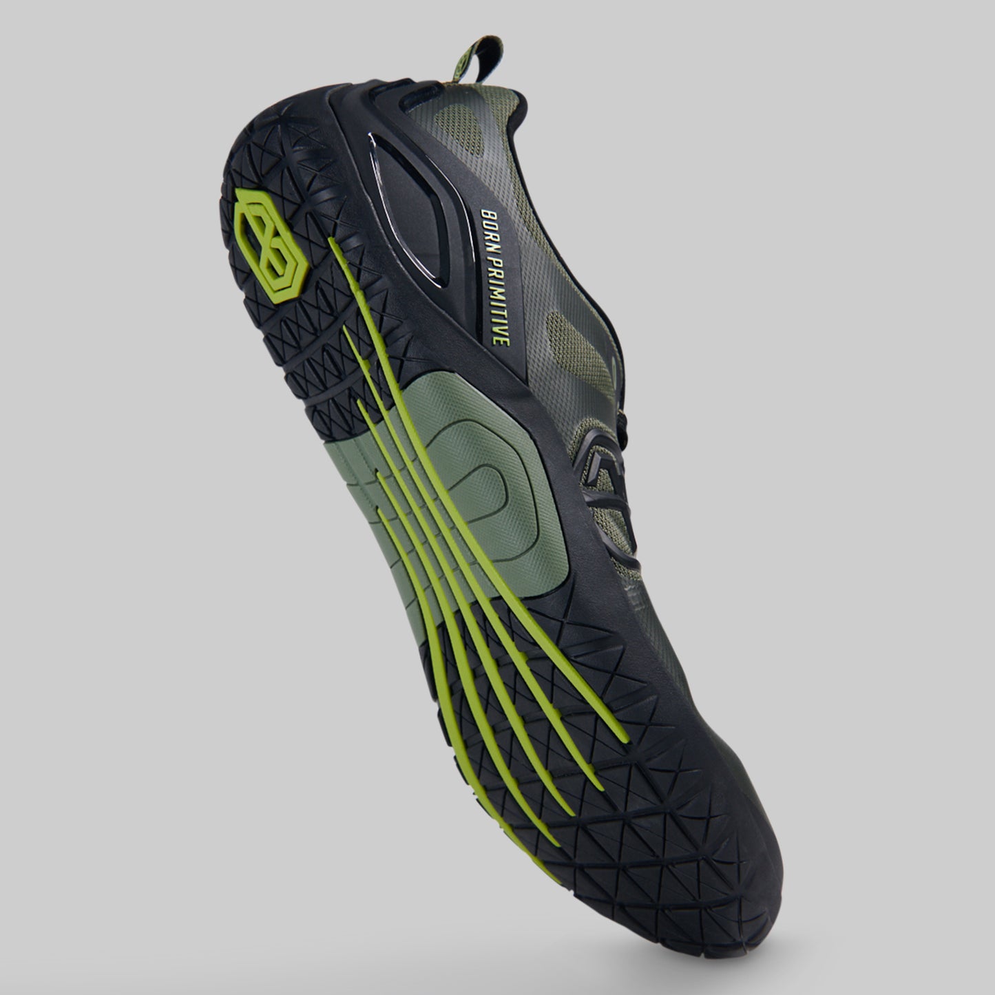 A single athletes barefoot shoe shown at an angle against a solid gray background, featuring a black and dark gray upper with olive green accents and bright neon yellow-green details on the sole.