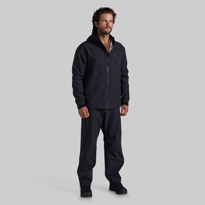 Full front view of black Mission FLEX Rain Pant 2.0 with matching rain jacket