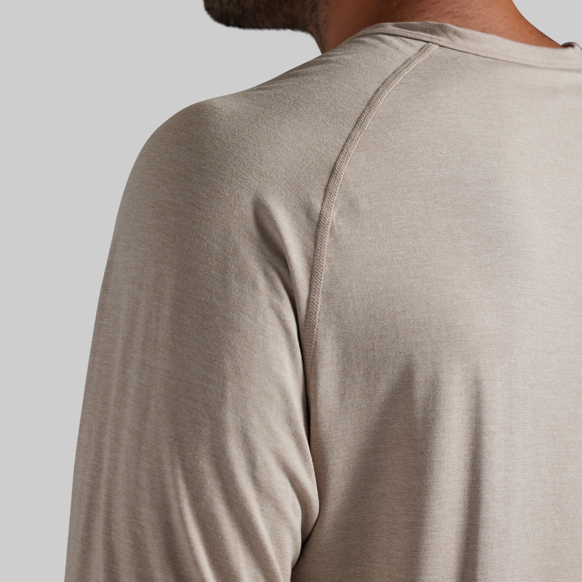 Close up of man wearing beige t-shirt