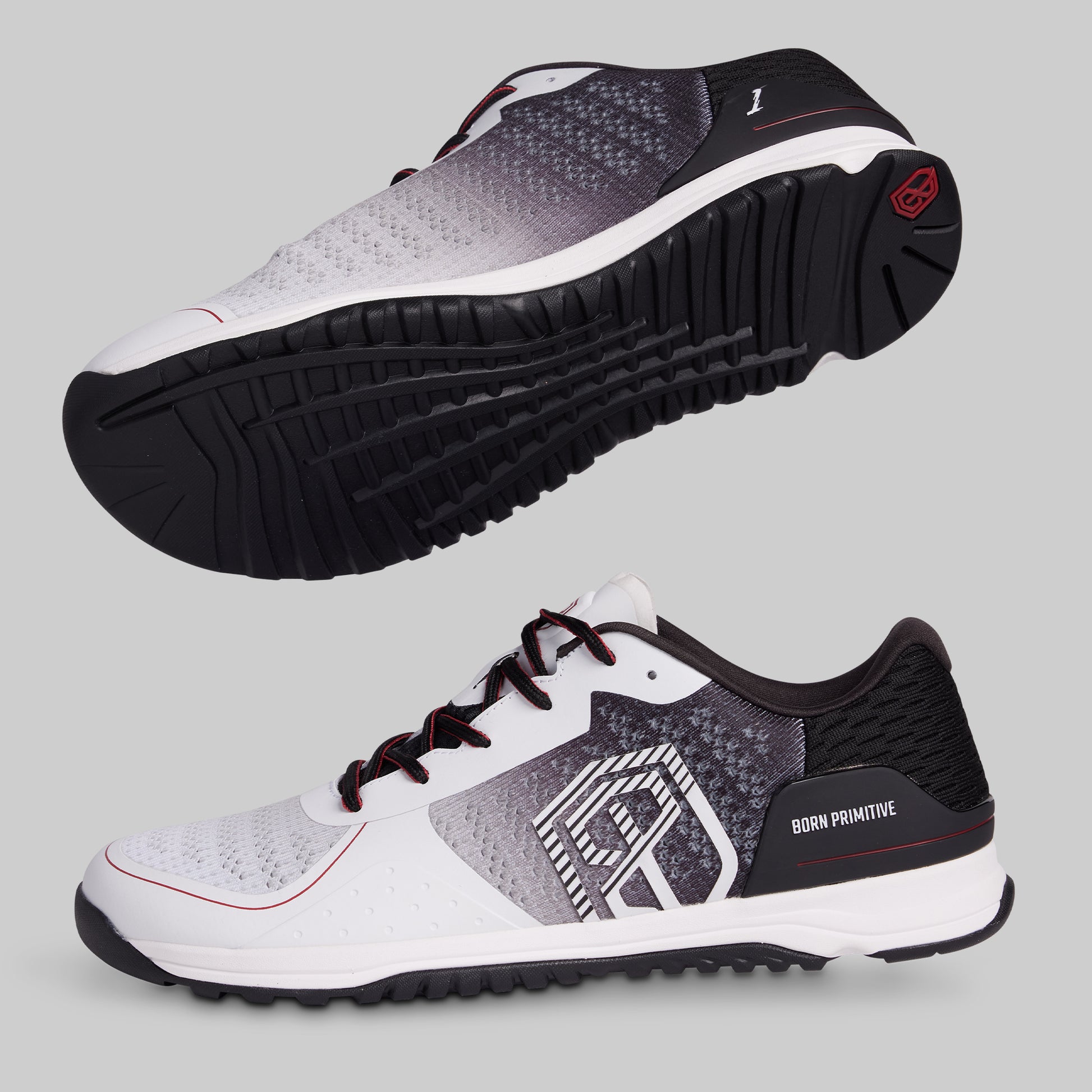 White and black athletic shoes with a visible brand logo on a gray background