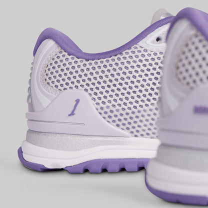 White and purple athletic shoe with mesh design on a light gray background