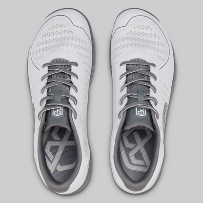 White and gray athletic shoes on a light gray background