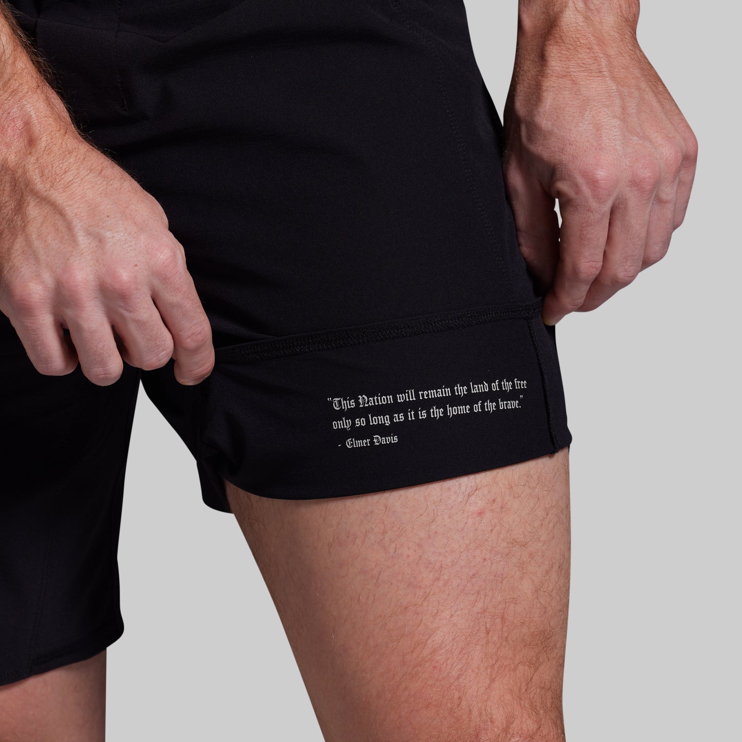 Black shorts with text on a gray background