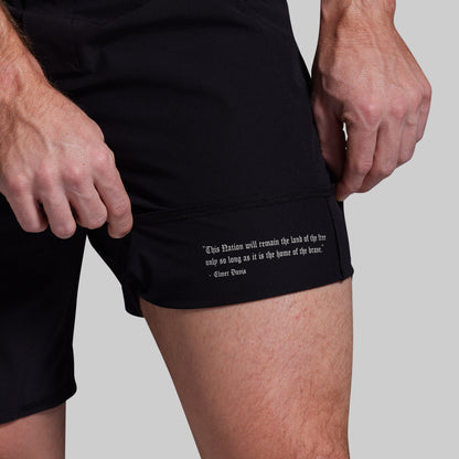Black shorts with text on a gray background