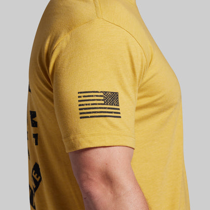 Yellow t-shirt with American flag graphic on a gray background