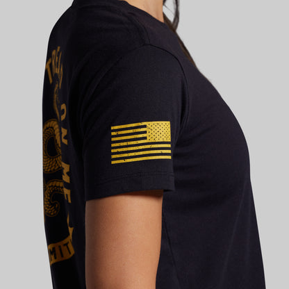 Black t-shirt with yellow graphics on a gray background