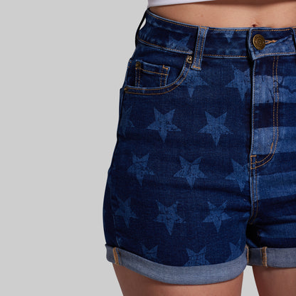 Blue denim shorts with star pattern on a plain background