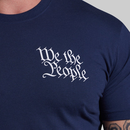 Navy blue t-shirt with 'We the People' text in white on a gray background