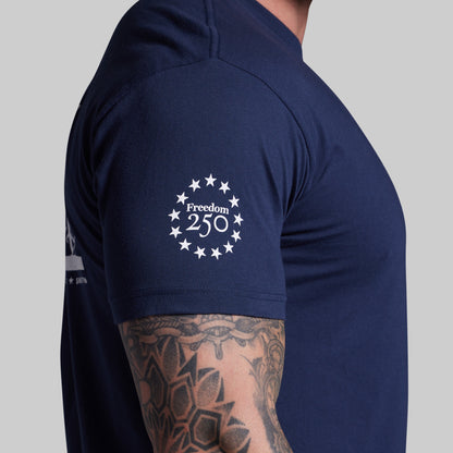 Navy blue t-shirt with 'Freedom 250' logo on a gray background