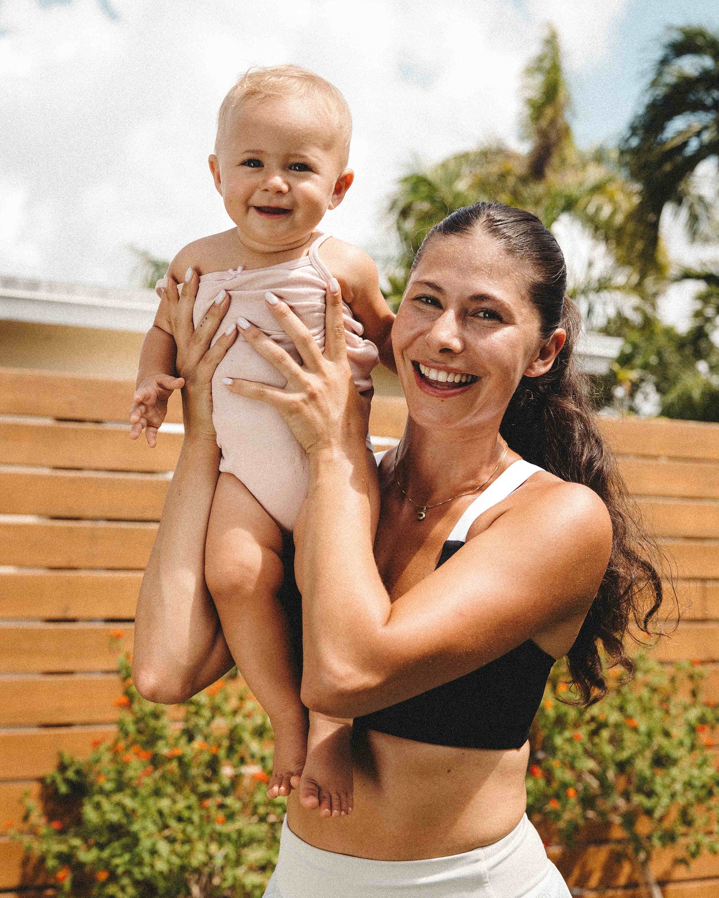 Woman holding child. 