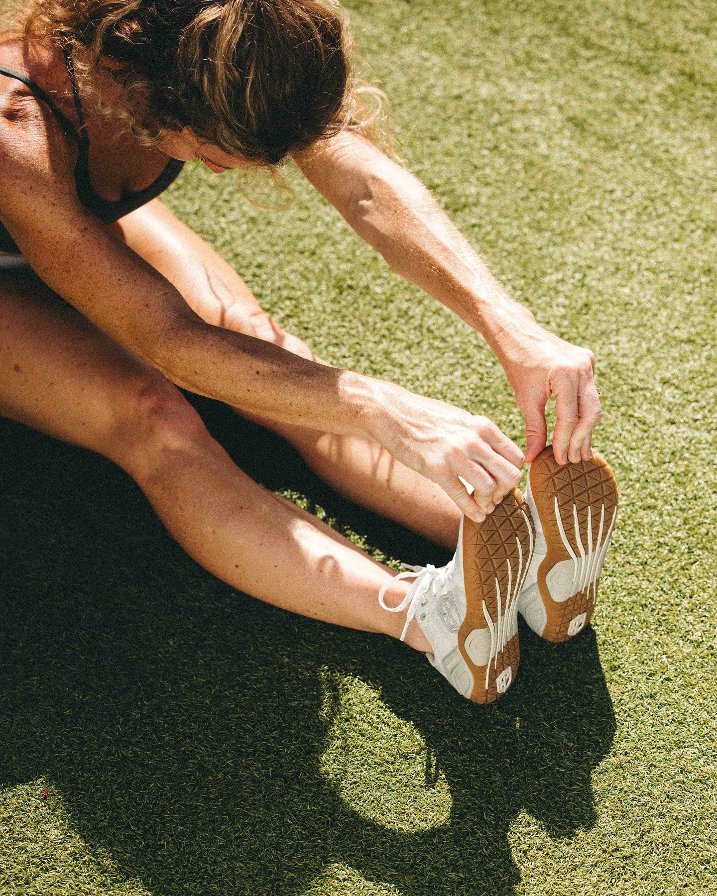 Barefoot athlete stretching 