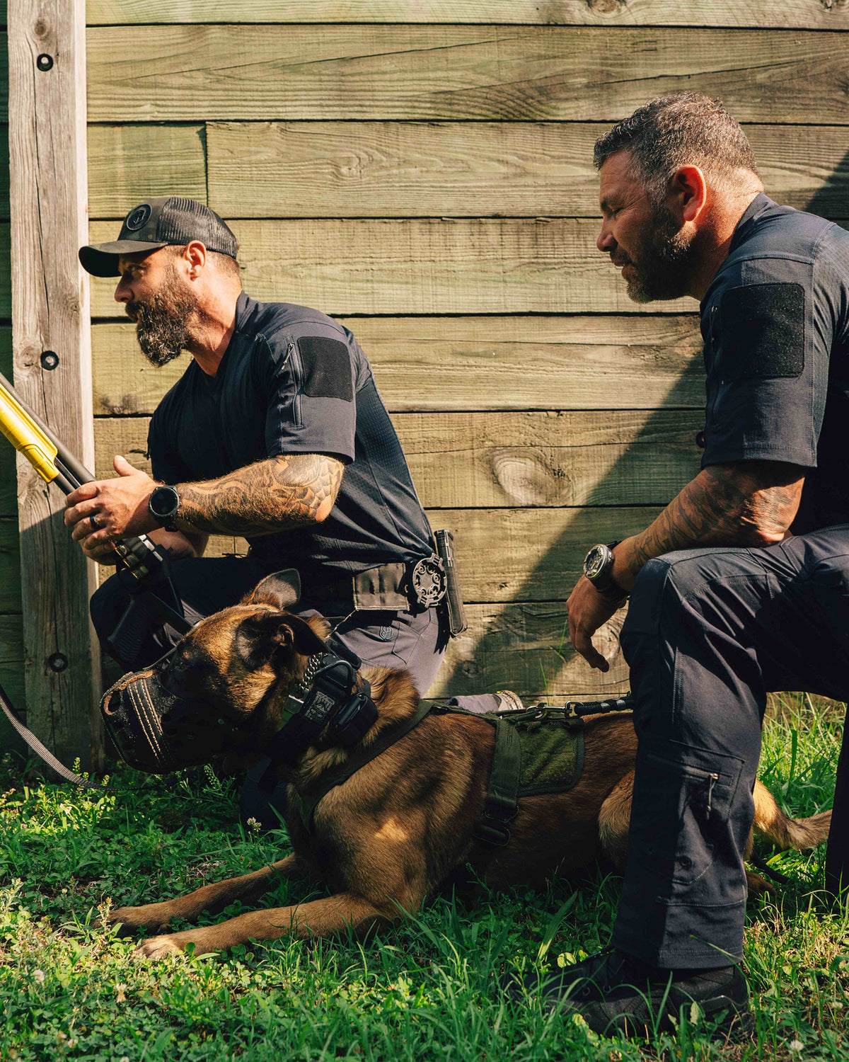 Defender 1 duty boot black being worn while holding a K9 police dog 