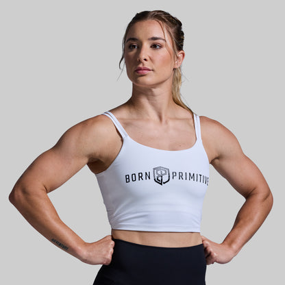 Woman wearing a white sports bra with a gray background