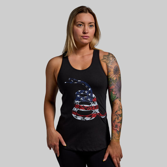 Woman wearing a black tank top with a snake design on a gray background