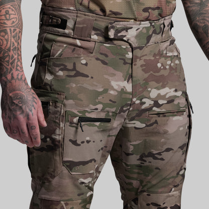 Camouflage pants with multiple pockets on a plain background