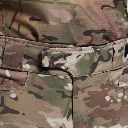 Close-up of a camouflage military uniform with visible stitching and pattern.