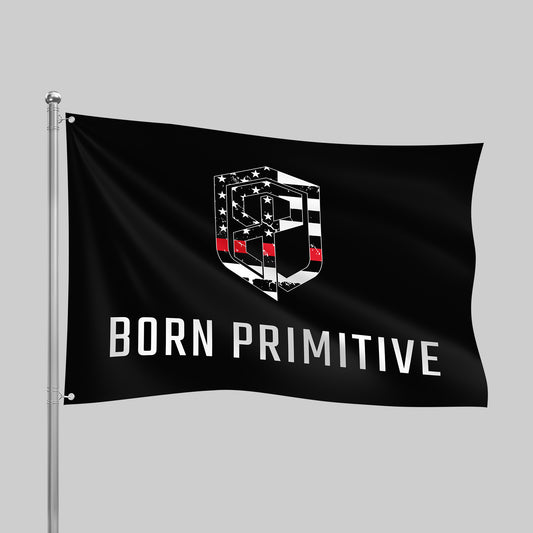Black flag with 'Born Primitive' logo on a gray background