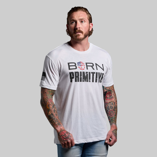 Man wearing a white t-shirt with 'Born Primitive' text and logo on a gray background