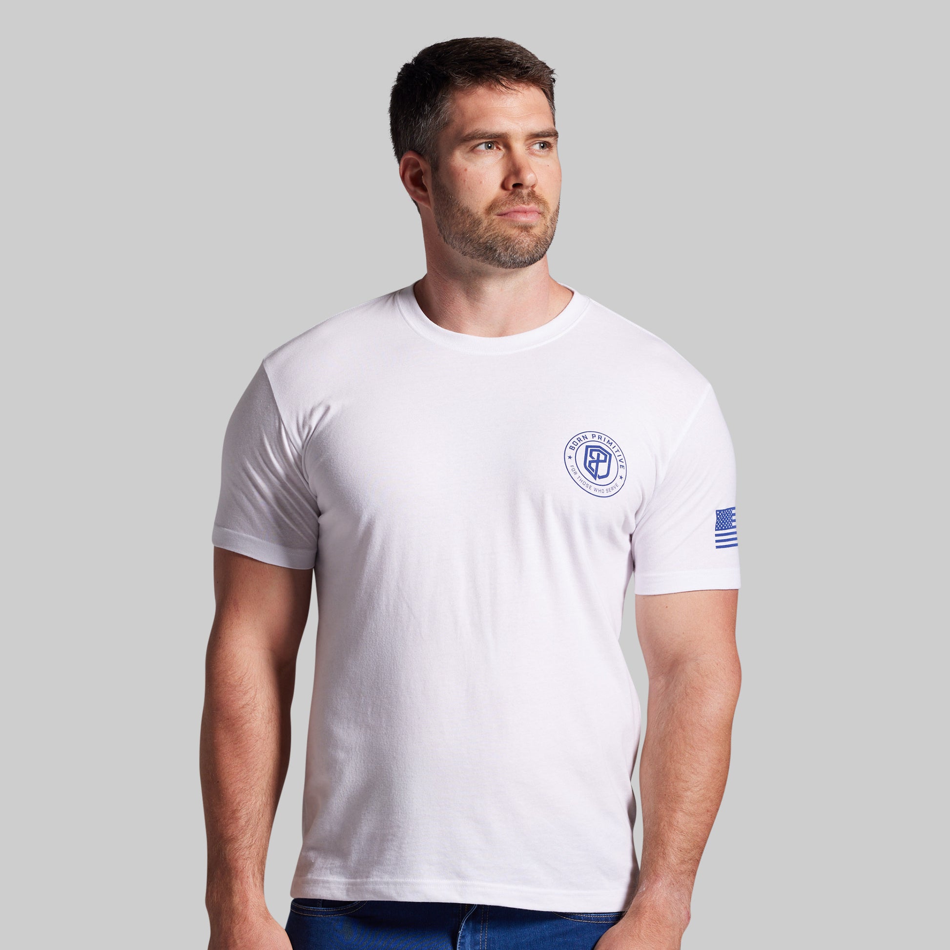 Man wearing a white t-shirt with a logo on a gray background