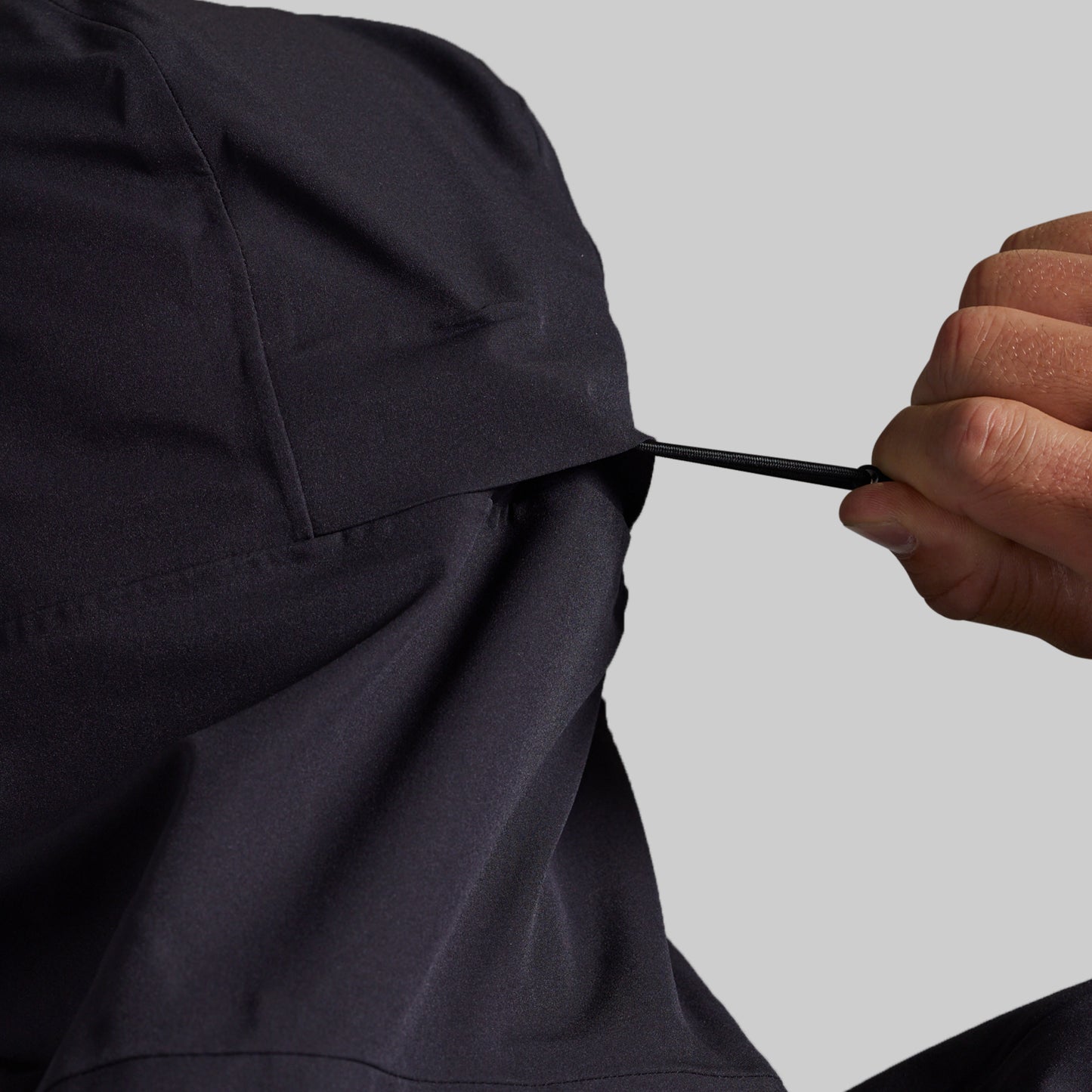 Adjustable waist drawcord on the black Mission FLEX Rain Jacket 2.0