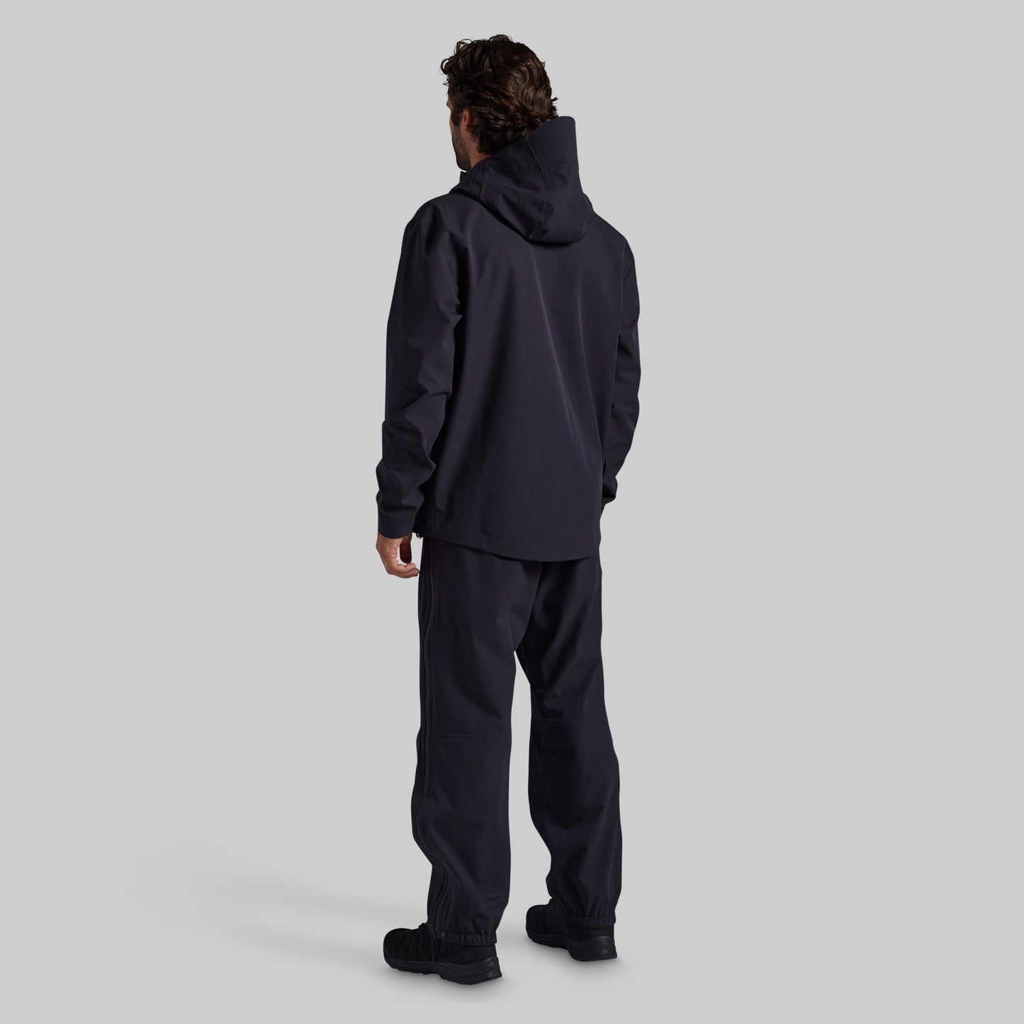 Back view of the black Mission FLEX Rain Jacket 2.0 with matching rain pants