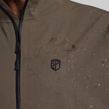 Water beading on the chest of the Ranger Green Mission FLEX Rain Jacket 2.0