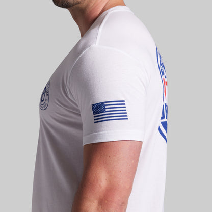 White t-shirt with American flag design on a gray background