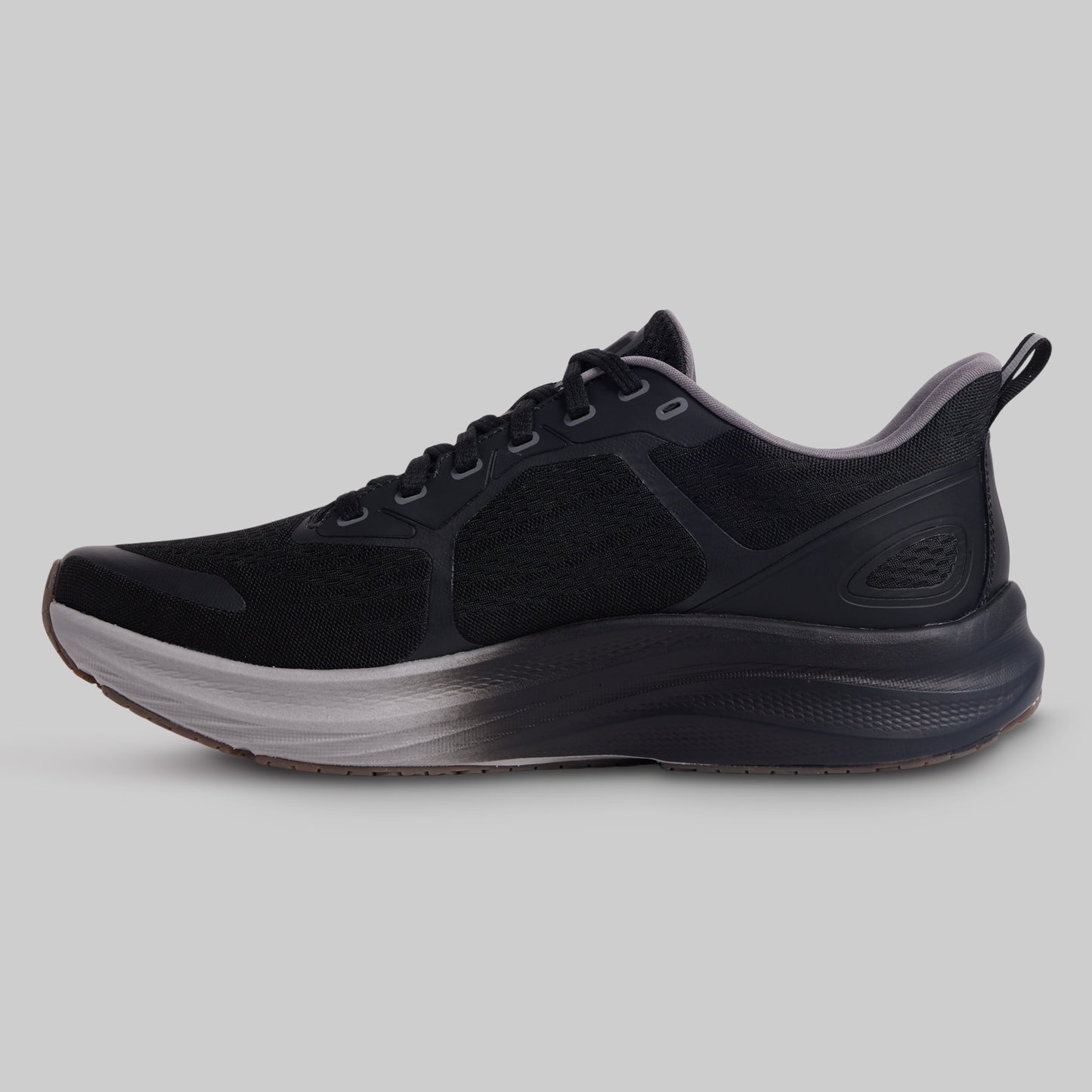 Black athletic shoe on a gray background