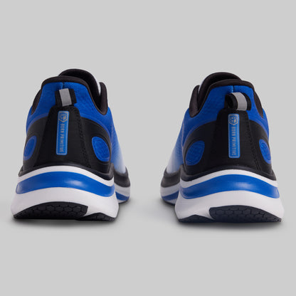 Blue and black athletic shoes on a gray background
