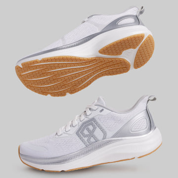 White running shoes with brown soles on a gray background