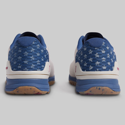 Blue and white patterned sneakers on a gray background
